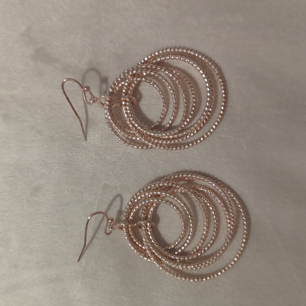 Rose gold colored hoop dangle earrings